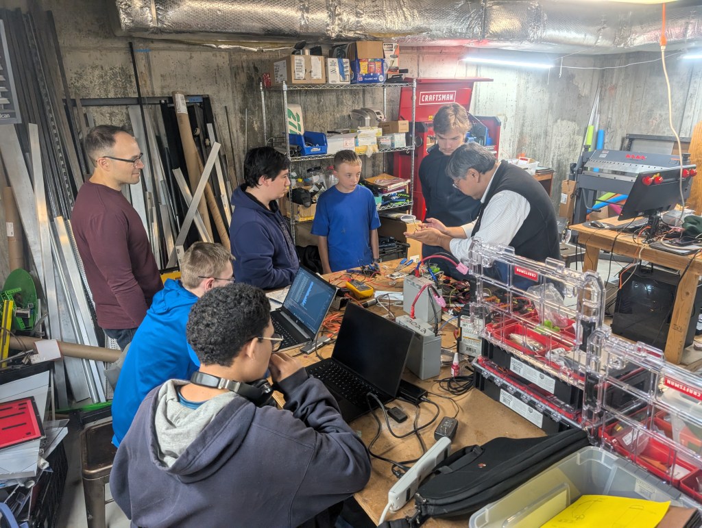 The team gathers to learn programming for the next FIRST robotics build season at their shop in Waterbury, CT